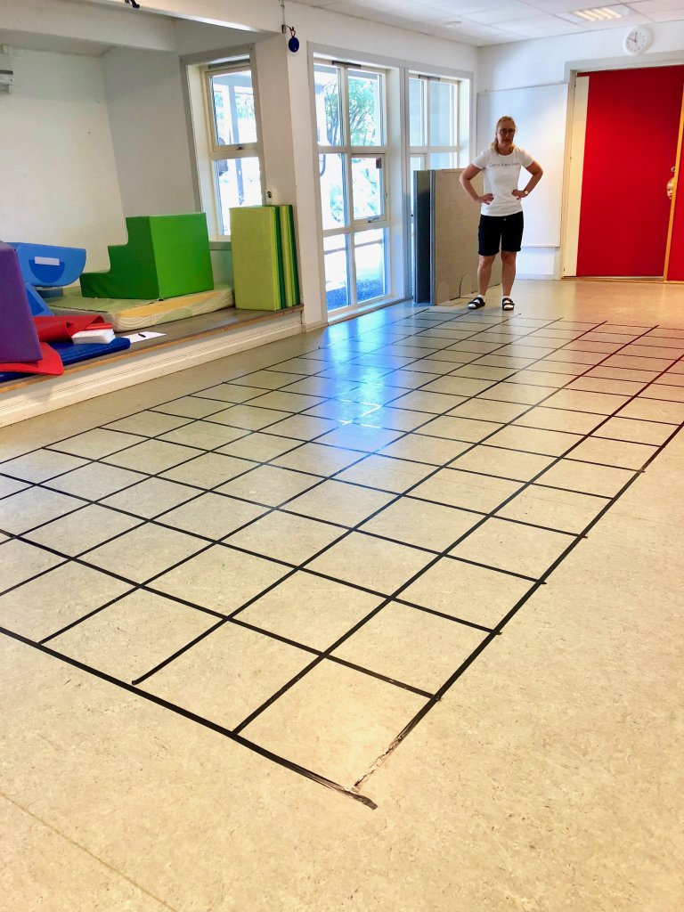 Board grid with awesome pre school teacher for scale